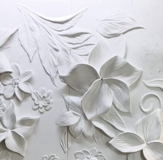 White floral plaster relief wall made in the Aadi Arts studio, Lucknow